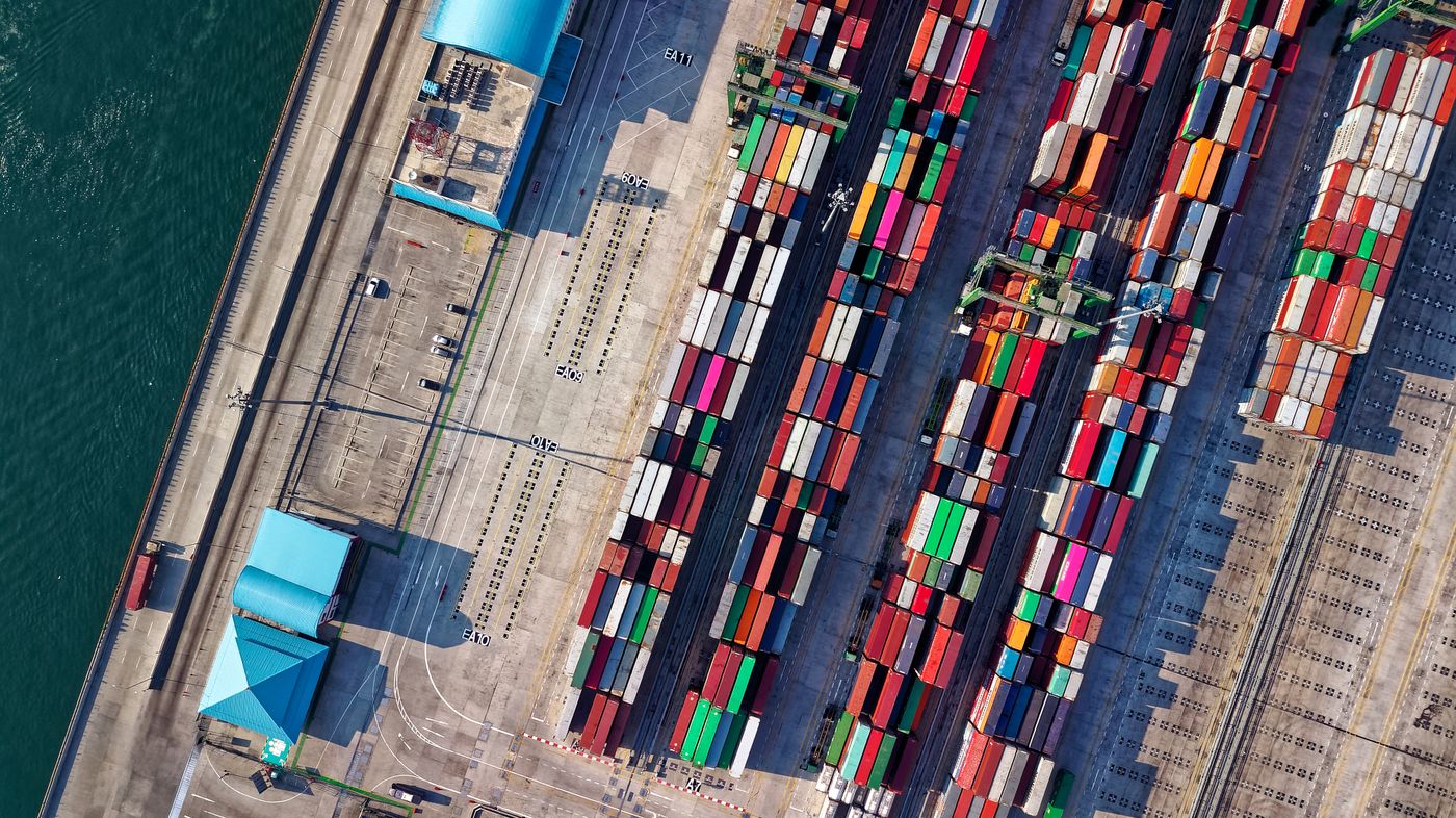 Container vessel berthed alongside a working quay