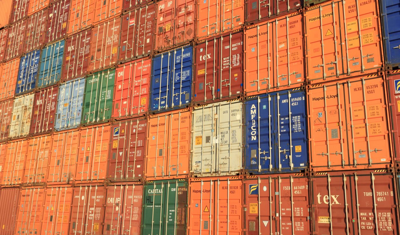 Stacked containers at a night terminal
